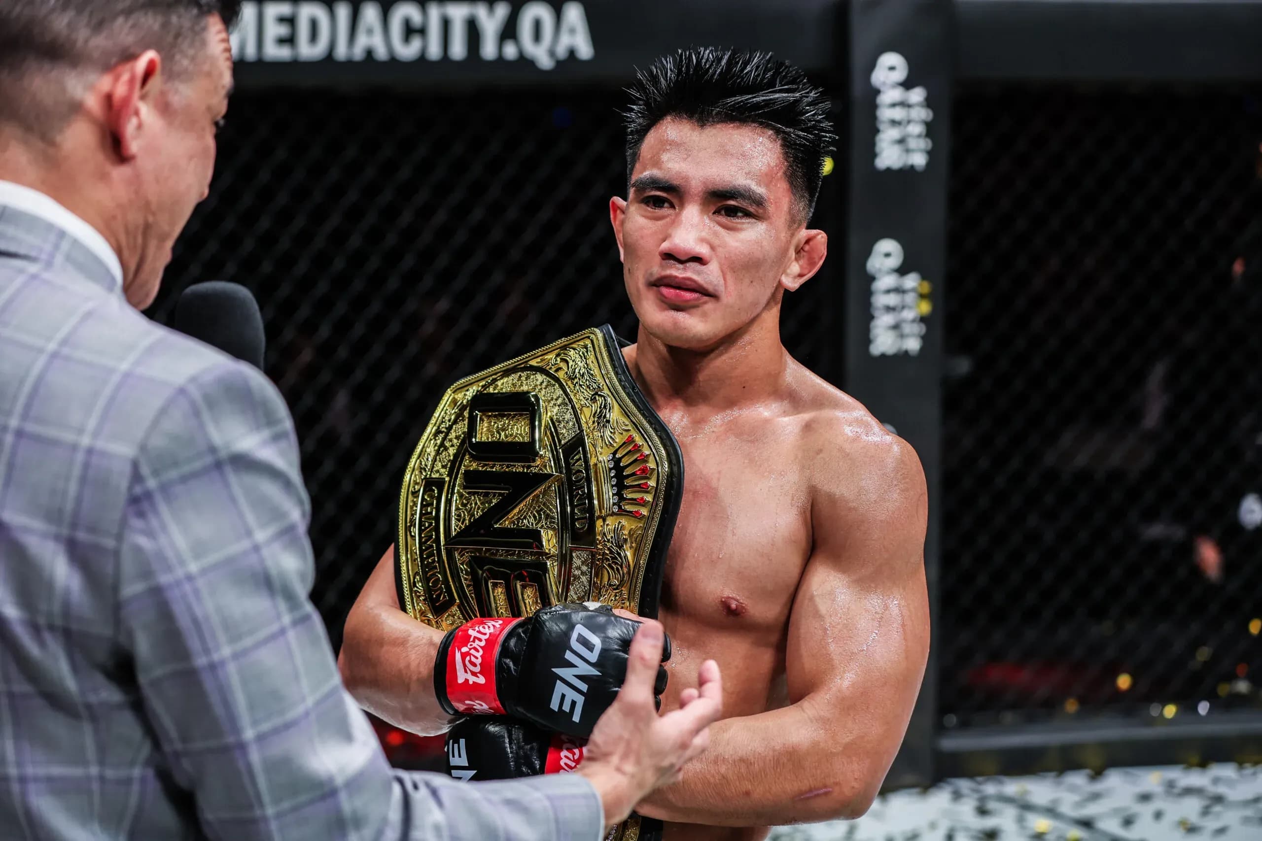 Filipino MMA fighter Joshua Pacio with the ONE Championship World TItle belt