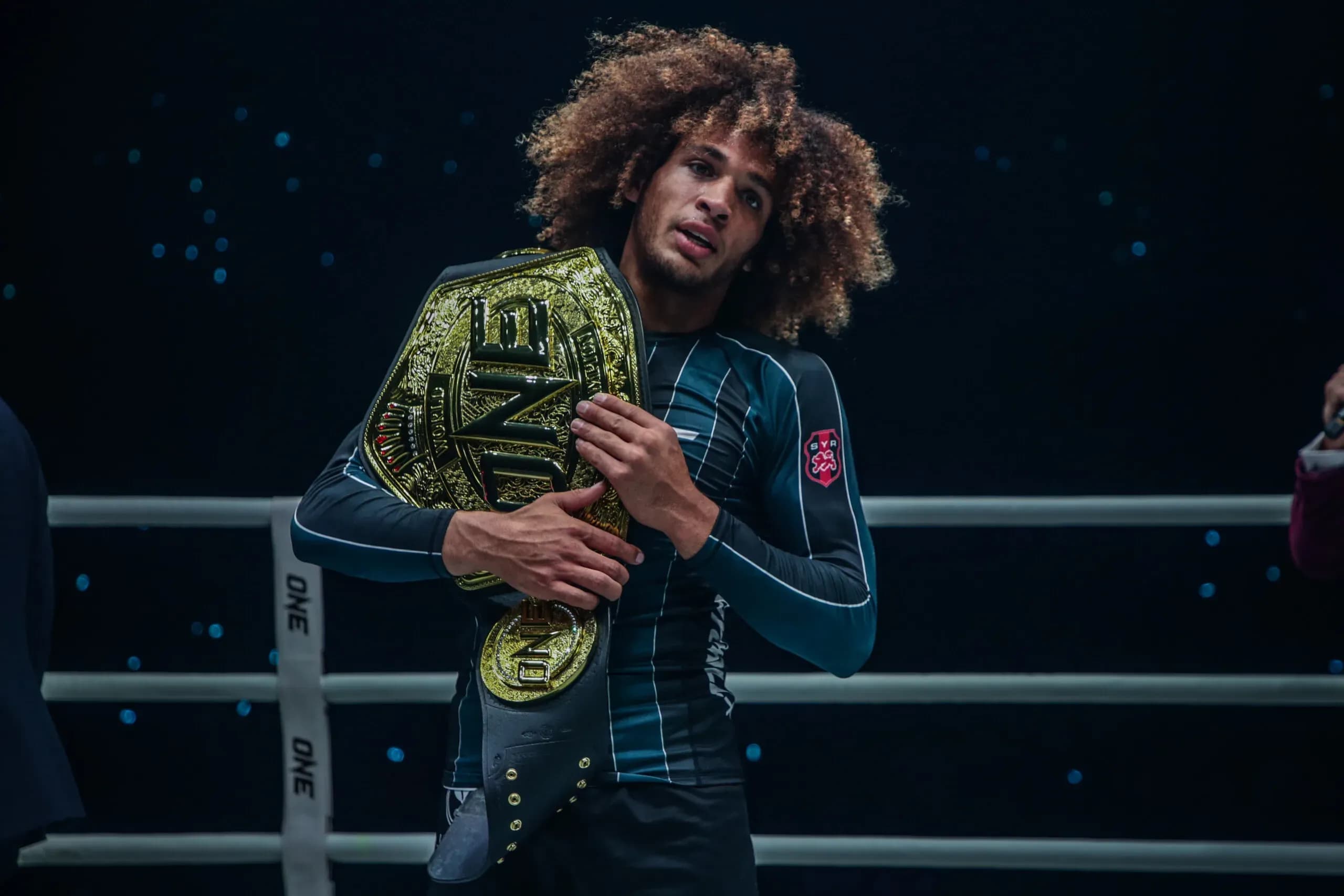 Submission Grappling World Champion Kade Ruotolo holds the ONE Championship belt