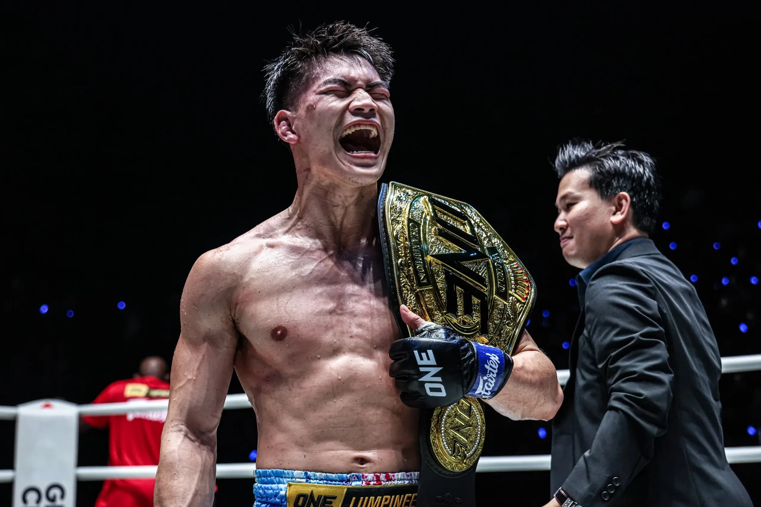 Muay Thai fighter Rambolek Chor Ajalaboon celebrates with the ONE World Title