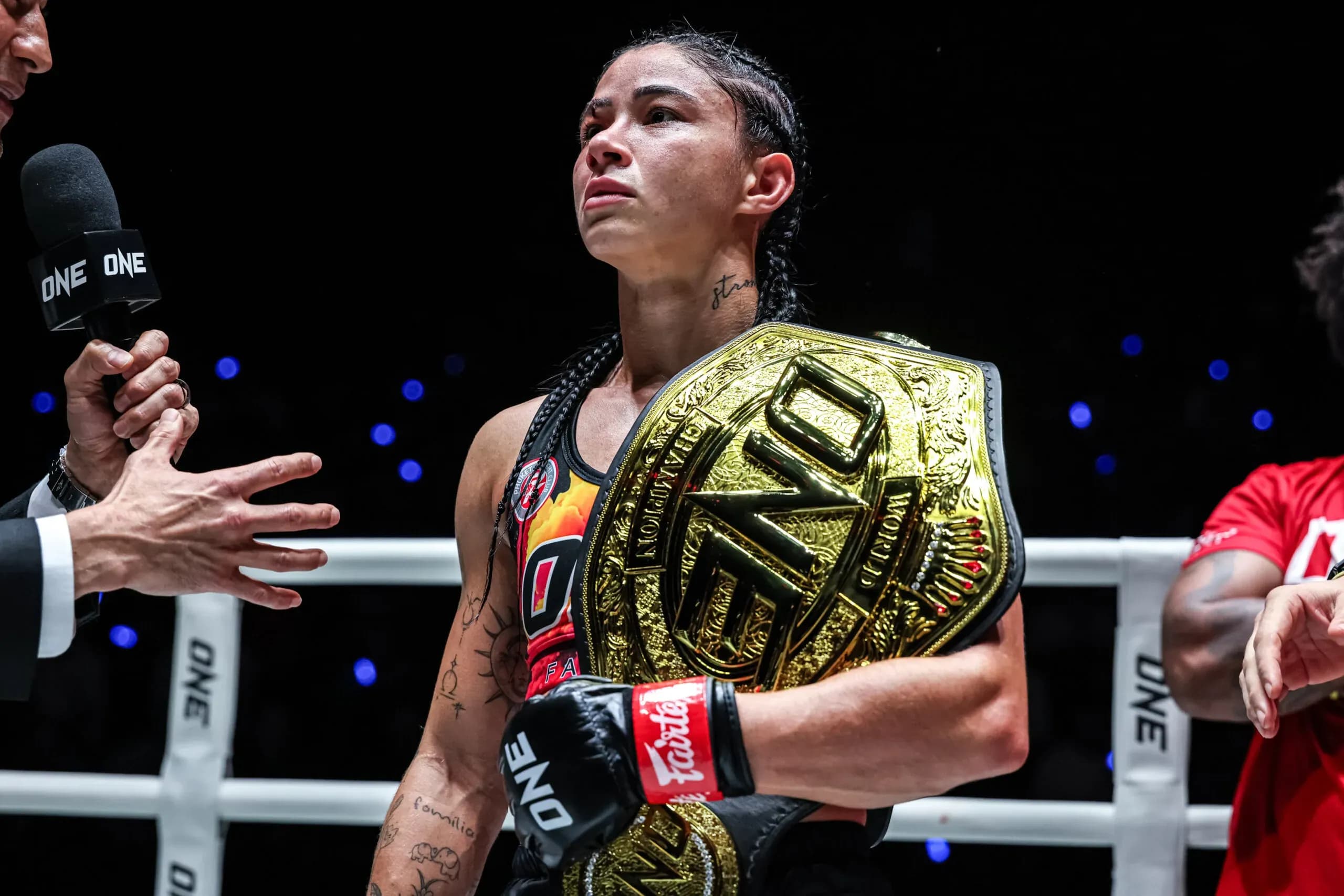 Brazilian Muay Thai fighter Allycia Hellen Rodrigues with the ONE Championship belt