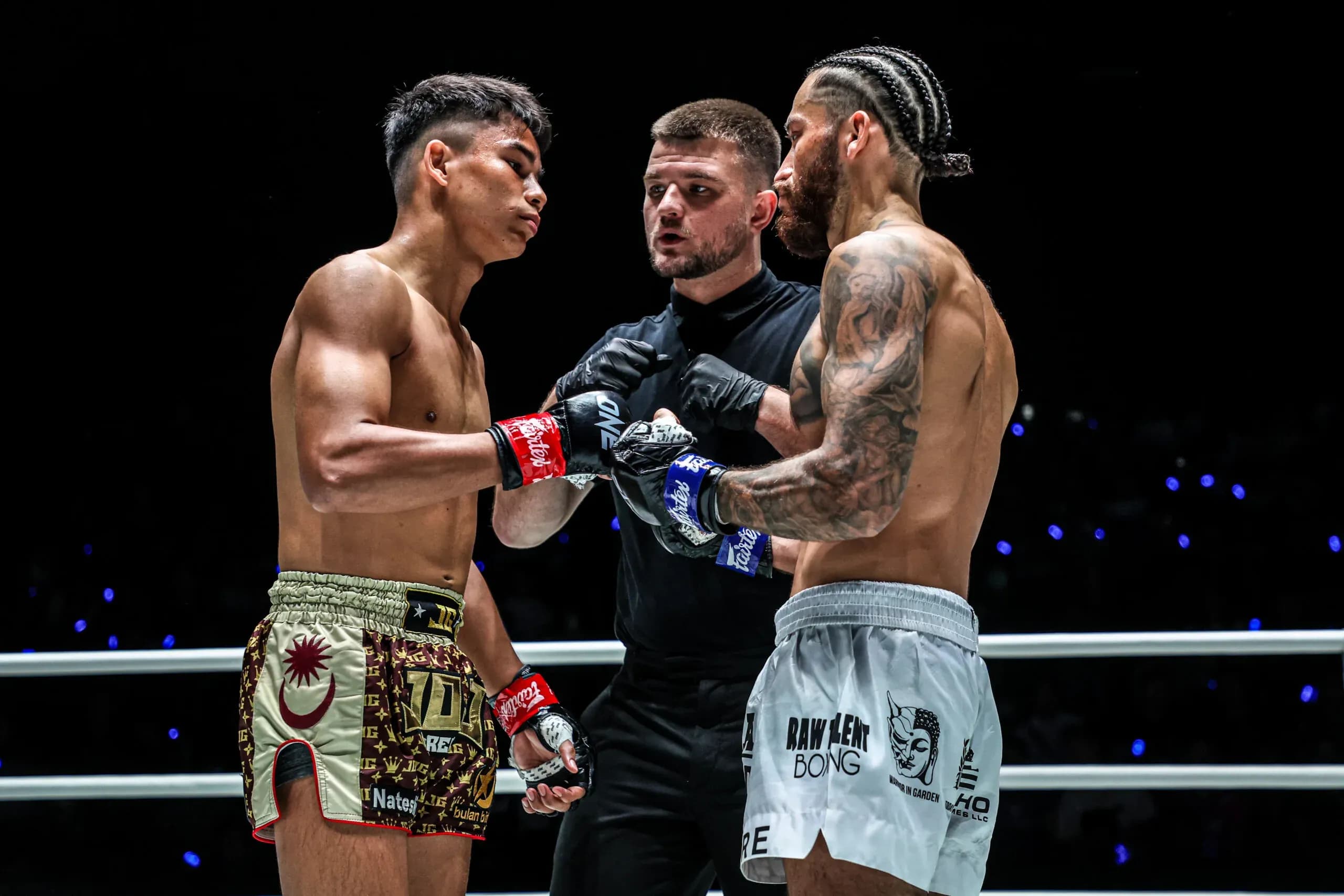Muay Thai fighters Johan Ghazalia and Diego Paez touch gloves in their first match