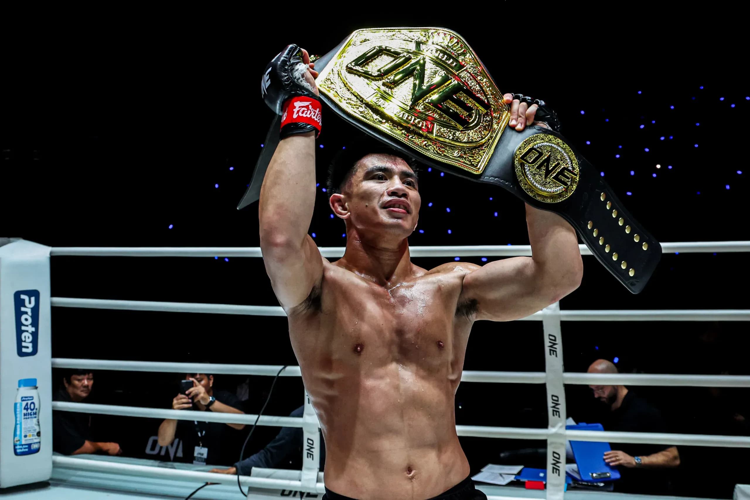 Strawweight king Joshua Pacio raises up the ONE Championship belt