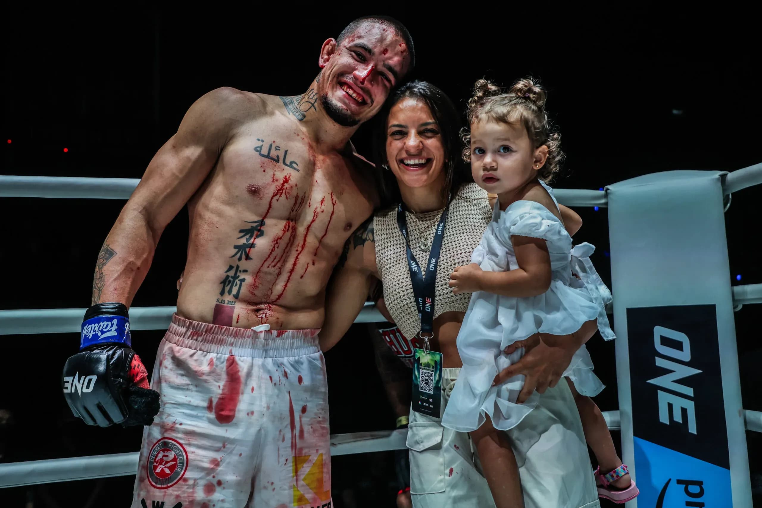 Brazilian MMA fighter Lucas Gabriel poses with his family following his win
