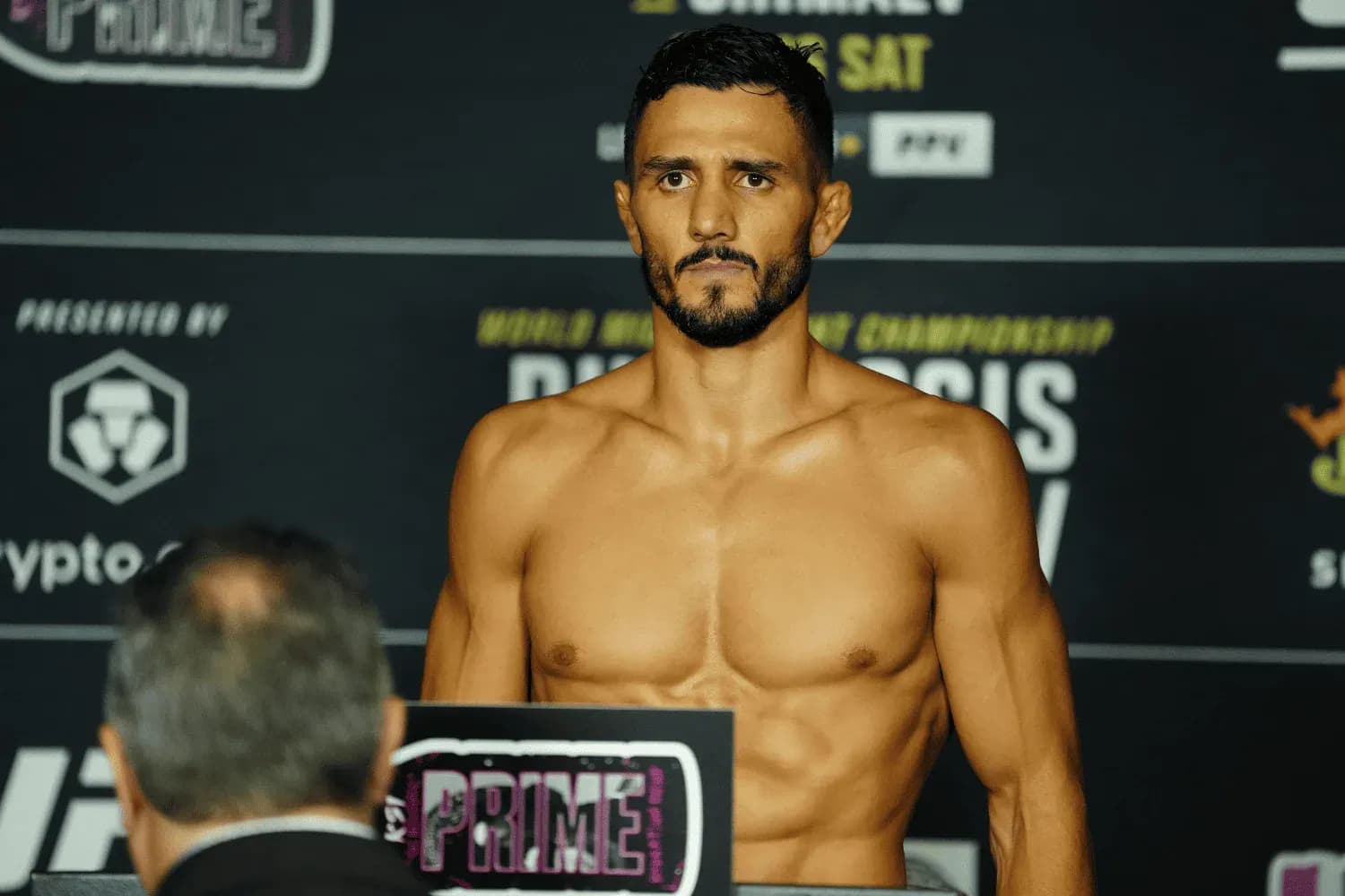 Aaron Pico steps on the scale for the official weigh-ins for UFC 319 - Du Plessis vs Chimaev