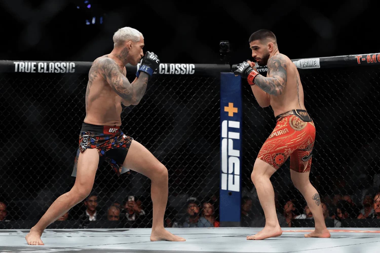Ilia Topuria and Charles Oliveira fight in the 5-round Lightweight Title Main Event bout during the UFC 317 event