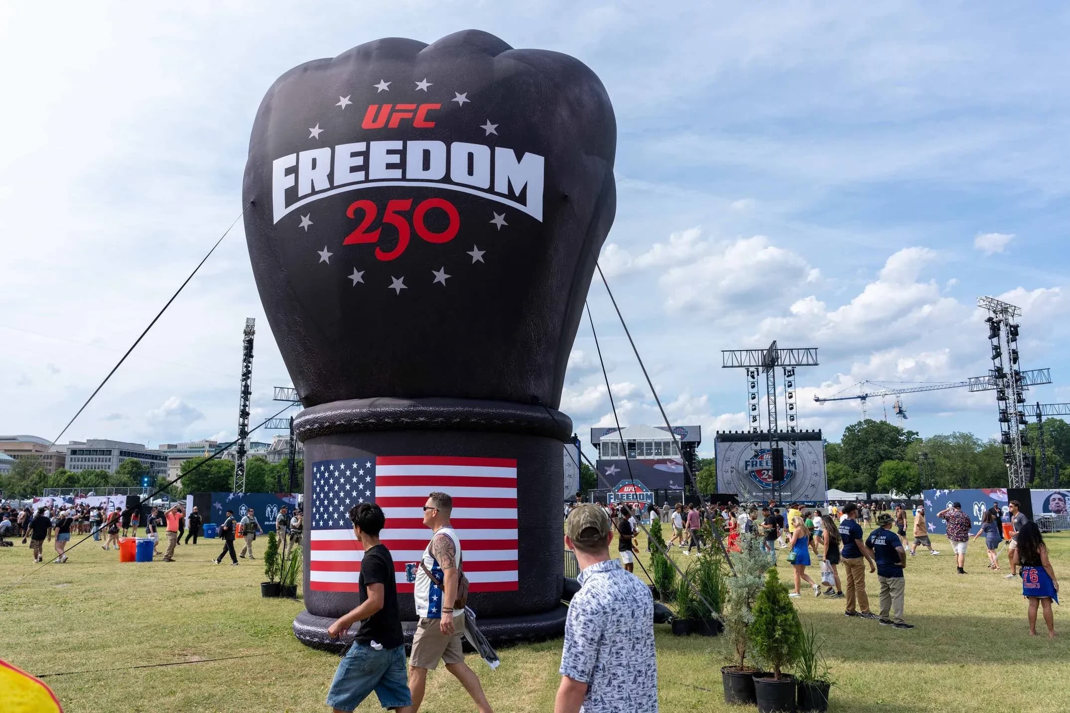Fans gather around a giant inflatable UFC Freedom 250 fist at the Washington D.C. fan zone